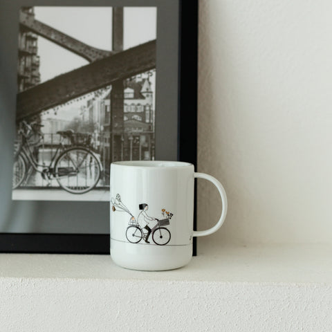 rader mug with girl on bicycle