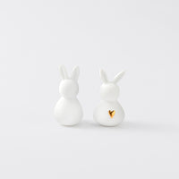 R17466 Two White Porcelain Bunnies on a white background