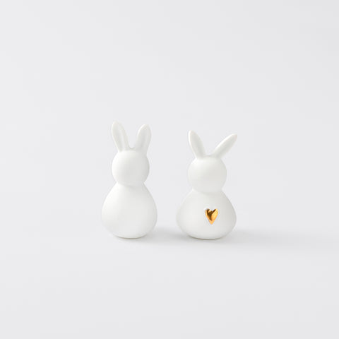 R17466 Two White Porcelain Bunnies on a white background